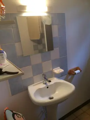 a bathroom with a sink and a mirror at Maison de Vacances in Pradelles-Cabardès