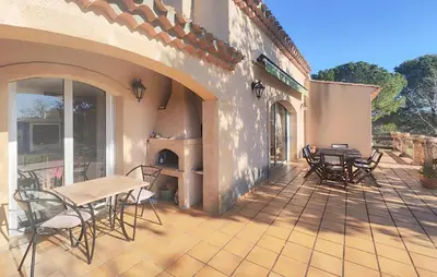 a patio with chairs and a table and a fireplace at Pet Friendly Home In Cruzy in Cruzy