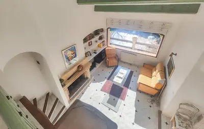 an overhead view of a living room with a large window at Pet Friendly Home In Cruzy in Cruzy