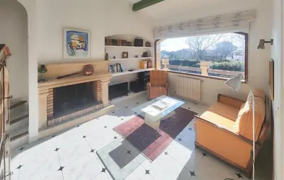 a living room with a fireplace and a couch at Pet Friendly Home In Cruzy in Cruzy
