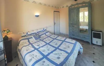 a bedroom with a bed and a dresser and a window at Pet Friendly Home In Cruzy in Cruzy