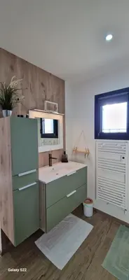 a bathroom with a sink and a mirror at Villa moderne avec piscine privée in Roubia