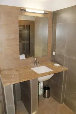 a bathroom with a sink and a mirror at Maison 4 ou 6 personnes au cœur Corbières in Saint-Laurent-de-la-Cabrerisse