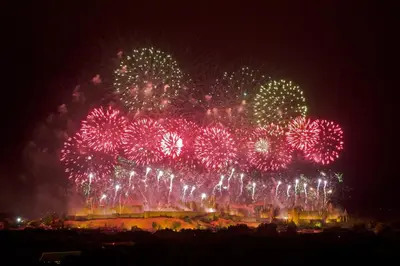 a bunch of fireworks exploding in the sky at night at Comme une évidence in Carcassonne