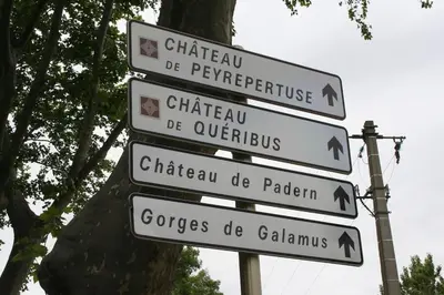 a group of signs on a pole next to a tree at Gite la Bonté, chaleureux avec une vue enchantée in Vélieux