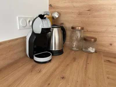 a coffee maker sitting on top of a wooden counter at Instant villa Serenity - 8 people with a view in Narbonne