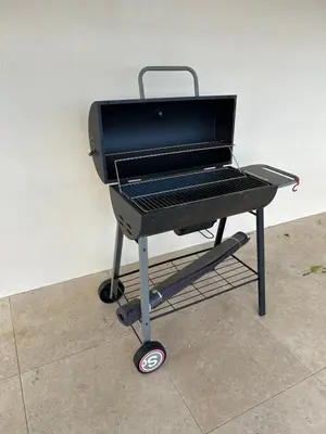 a barbecue grill sitting on a stand next to a wall at Instant villa Serenity - 8 people with a view in Narbonne
