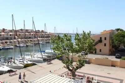 a group of boats are docked in a marina at Appartement avec grande terrasse vue panoramique GN400-024 in Gruissan