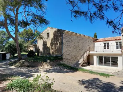 a house with a tree in front of it at House on winery in Azille