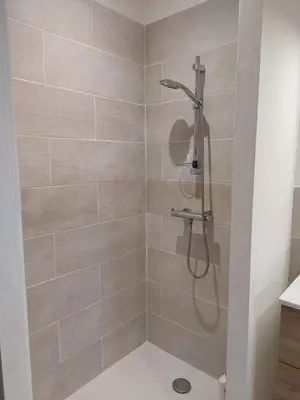 a shower with a shower head in a bathroom at House on winery in Azille