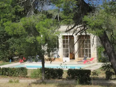 a house with a swimming pool in front of it at House on winery in Azille