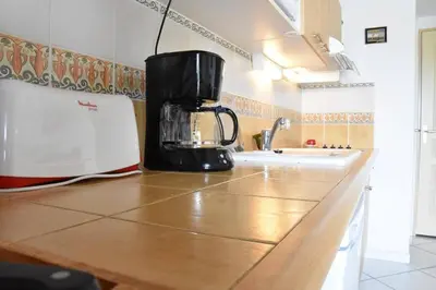 a blender sitting on top of a kitchen counter at Villa avec terrasse et garage proche plage GA120-038 in Gruissan