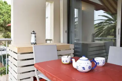a table with two tea cups on top of it at Appartement 2 pièces - Gruissan GN580-028 in Gruissan