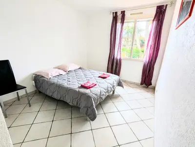 a small bedroom with a bed and a window at Villa Le Jardin des Délices - de 2 à 8 personnes avec Piscine in Raissac-dʼAude