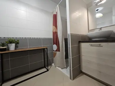 a bathroom with a sink and a toilet and a shower at POP ART Casino vibe! in Gruissan
