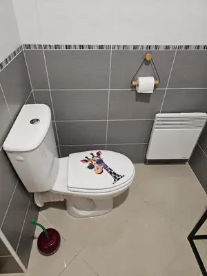 a bathroom with a toilet with a hello kitty sticker on it at POP ART Casino vibe! in Gruissan