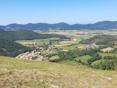 a view of a valley from the top of a hill at la tute de l'ours in Roquefeuil