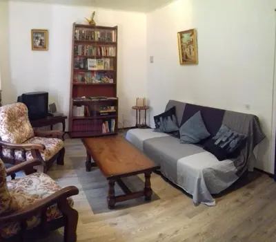 a living room with a couch and a coffee table at la tute de l'ours in Roquefeuil