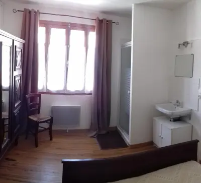 a bathroom with a sink and a window at la tute de l'ours in Roquefeuil