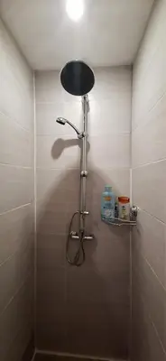 a shower in a bathroom with a glass door at Charming Apartment in La Redorte in La Redorte