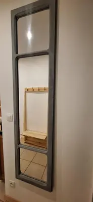 a mirror hanging on a wall in a room at Charming Apartment in La Redorte in La Redorte