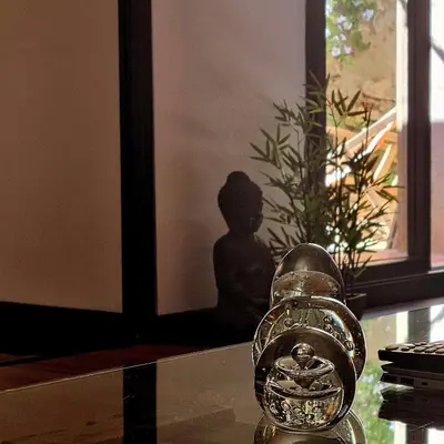 a glass object sitting on top of a glass table at La Bulle Carrée - Centre Historique médiéval - in Lapalme