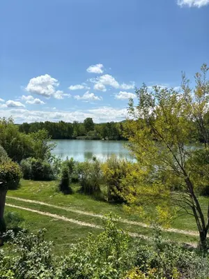 a view of a lake from a house at Lac de Latournerie in Cazals-des-Baylès