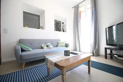 a living room with a couch and a coffee table at T3 de 70m2 avec sauna, piscine intérieure chauffée in Siran