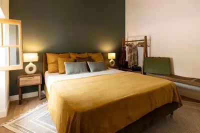 a bedroom with a large bed with two pillows at Maison Zellige - Rooftop - Gruissan Center in Gruissan