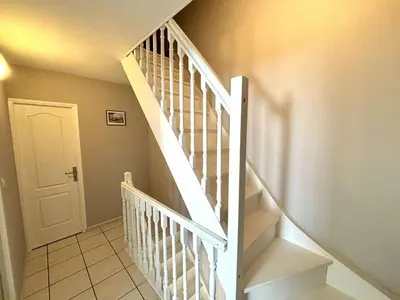 a staircase with white railings in a home at Appartement 3 pièces Port la Nouvelle PN000-151 in Port-la-Nouvelle