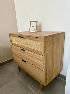 a wooden dresser with a picture on top of it at Douce parenthèse in Carcassonne