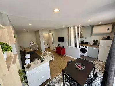 a kitchen and living room with a table and a dining room at Appartement Studio PORT LA NOUVELLE PN480-046 in Port-la-Nouvelle