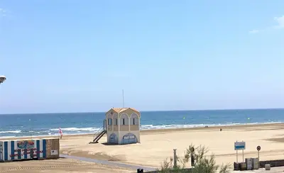 a small building on a beach next to the ocean at Appartement Studio PORT LA NOUVELLE PN480-046 in Port-la-Nouvelle