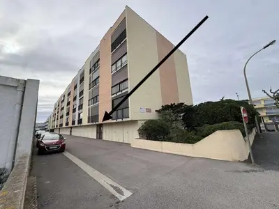 a building with a car parked in front of it at Appartement Studio PORT LA NOUVELLE PN480-046 in Port-la-Nouvelle