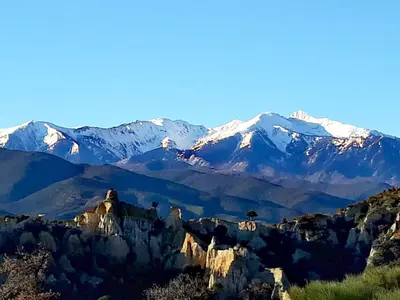 a view of a mountain range with snow covered mountains at Vue D Ansignan in Ansignan