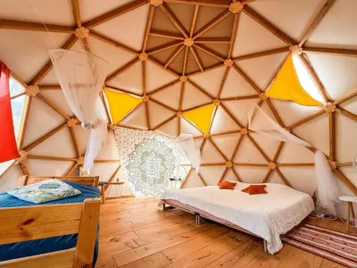 a room with a bed in a yurt at Centre Harmonia in Rennes-les-Bains