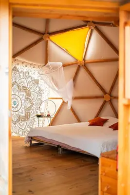 a bedroom with a canopy bed in a room at Centre Harmonia in Rennes-les-Bains