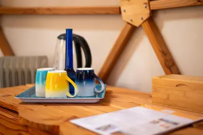 a table with two coffee mugs on top of it at Centre Harmonia in Rennes-les-Bains
