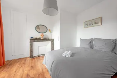 a bedroom with a bed with two stuffed animals on it at Aurora - T1 - 25 in Carcassonne