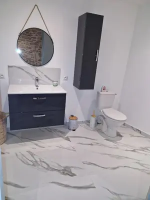 a bathroom with a sink and a toilet at village house in Villegly