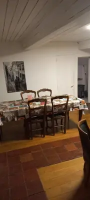 a room with a table and chairs in it at Maison calme in Payrin-Augmontel