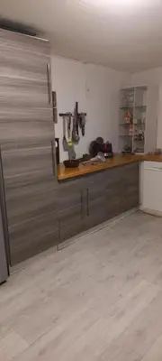 a kitchen with a wooden counter top in a room at Maison calme in Payrin-Augmontel