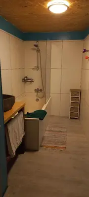 a bathroom with a shower and a sink in a room at Maison calme in Payrin-Augmontel
