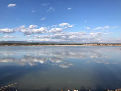 a large body of water with clouds in the sky at Chez LuLu Holiday Home in Olonzac