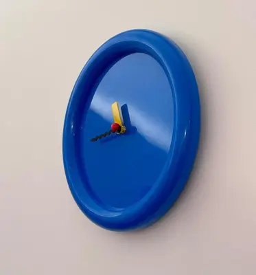 a blue mirror with a small toy in it at Appartement Thème Années 60' l Baignoire Jets l Clim l Netflix in Castres