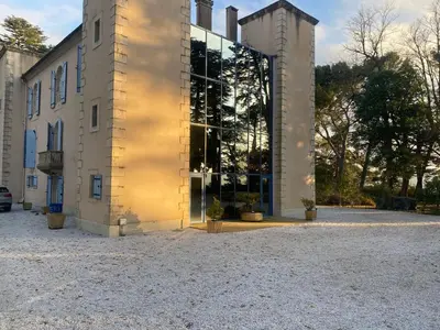 a building with a large window on the side of it at Ferrabouc in Mas-Saintes-Puelles
