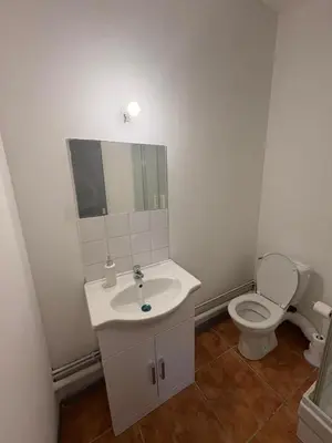 a bathroom with a sink and a toilet at Grand studio proche centre in Narbonne