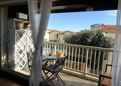 a view of a balcony with a table and chairs at Fleur Australe in Gruissan