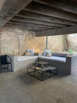 a living room with a couch and a table at La Tuilerie du Bazalac in Trèbes