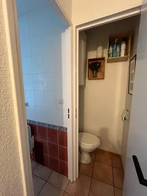 a bathroom with a toilet and a shower at T2 cabine relooké avec piscine idéalement situé in Gruissan